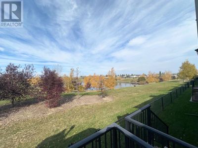 47 Aquitania Cir W, Townhouse with 2 bedrooms, 3 bathrooms and 2 parking in Lethbridge AB | Image 3