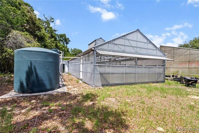 view of the water storage tanks for the large green house | Image 6