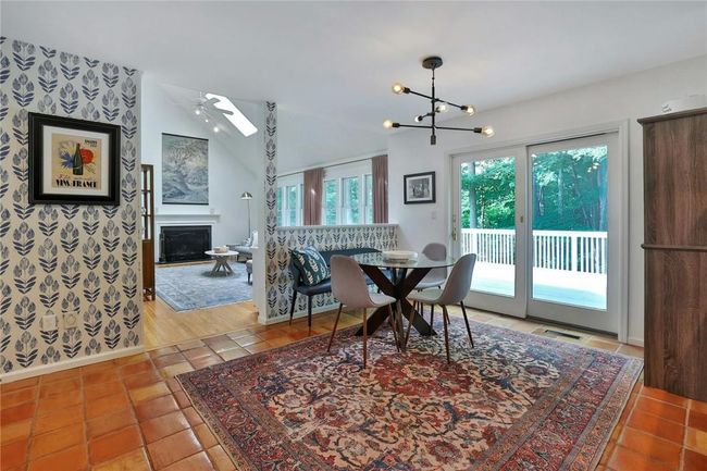Kitchen eat in area with sliders to deck overlooking back yard | Image 11