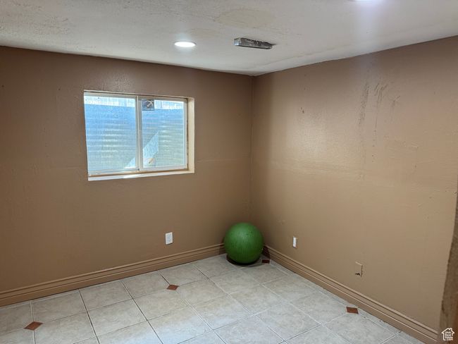 Empty room with baseboards and light tile patterned floors | Image 11