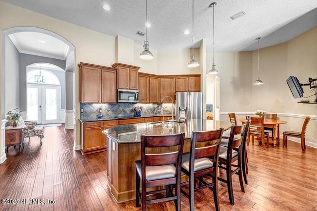 Gourmet open kitchen with large island with counter seating | Image 14