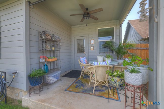 Covered patio with ceiling fan. | Image 33