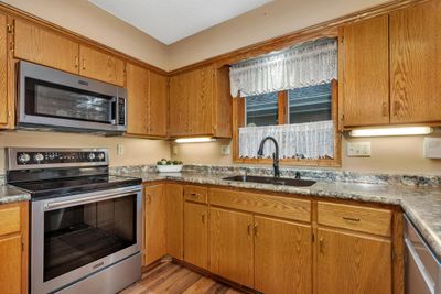 Stainless steel appliances throughout. | Image 2