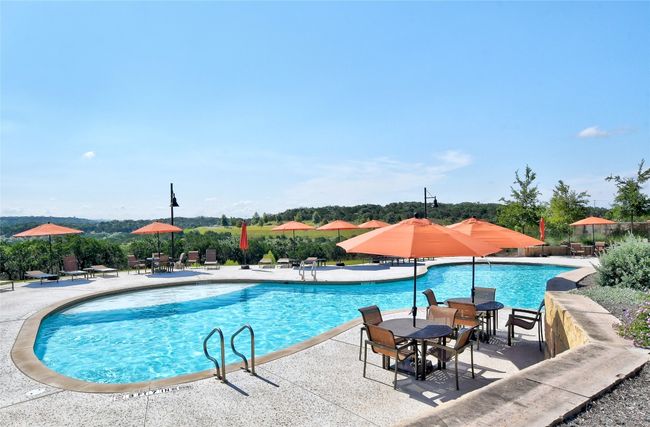 Community pool with a patio area | Image 40