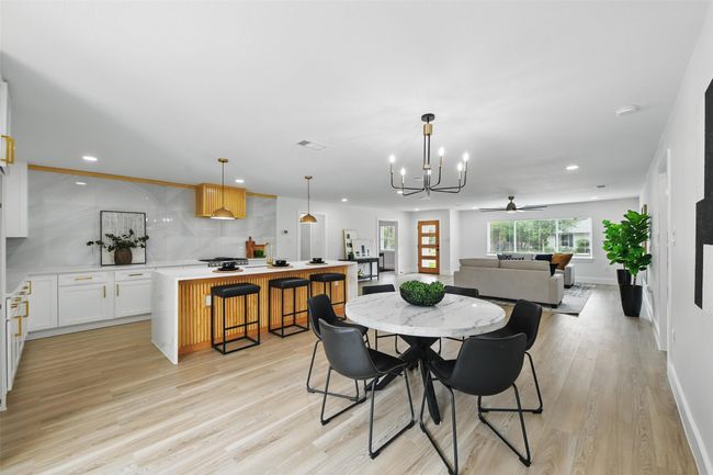 Dining area with a chandelier, light wood-style flooring, recessed lighting, baseboards, and ceiling fan | Image 16