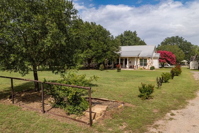 Ranch-style house featuring a porch | Image 35