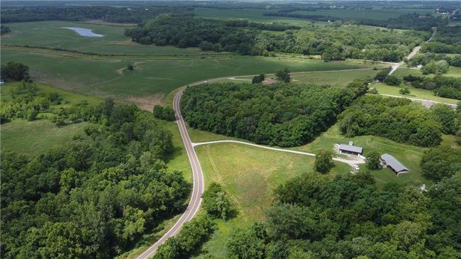 View of property location with rural landscape and a heavily wooded area | Image 61