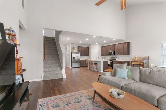 Open living area with vaulted ceiling. | Image 8