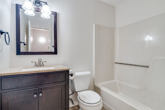 Full bathroom featuring vanity and shower / bathtub combination | Image 23