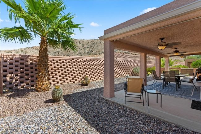 View of patio / terrace with outdoor dining space and a ceiling fan | Image 43