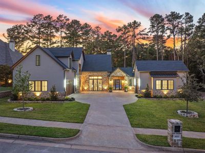 View of front facade with a yard | Image 1