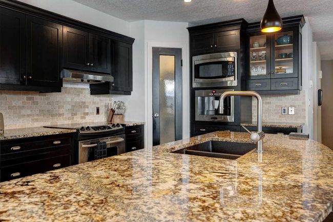 B - 116 Otter, Home with 5 bedrooms, 4 bathrooms and 3 parking in Banff AB | Image 6