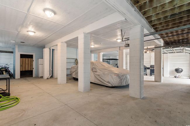 Below grade area featuring freestanding refrigerator | Image 35