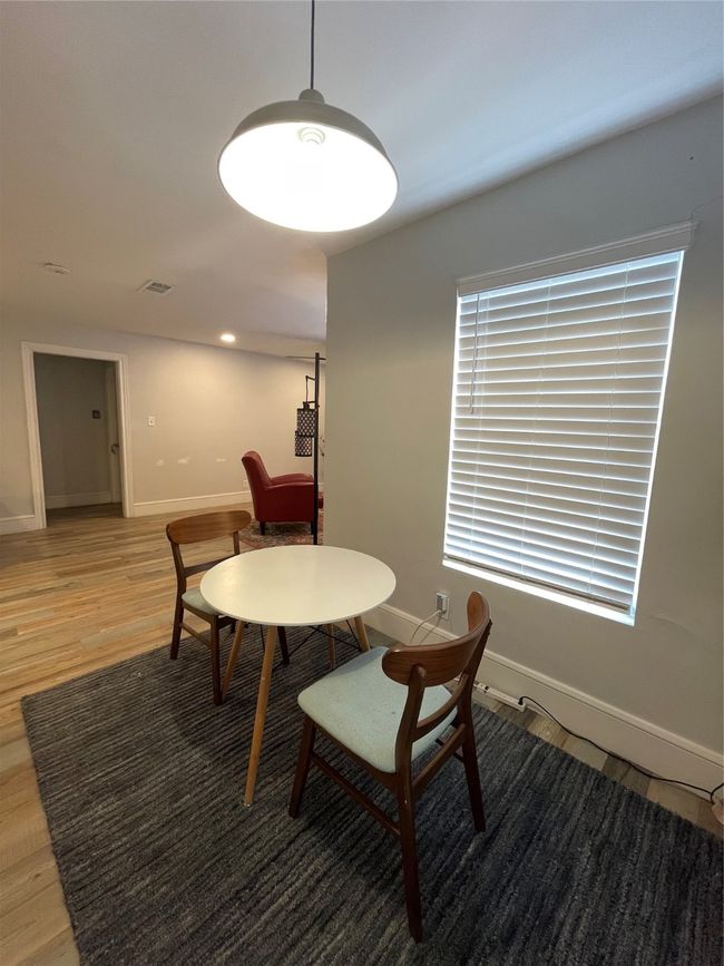 Dining room with light wood-style floors | Image 9