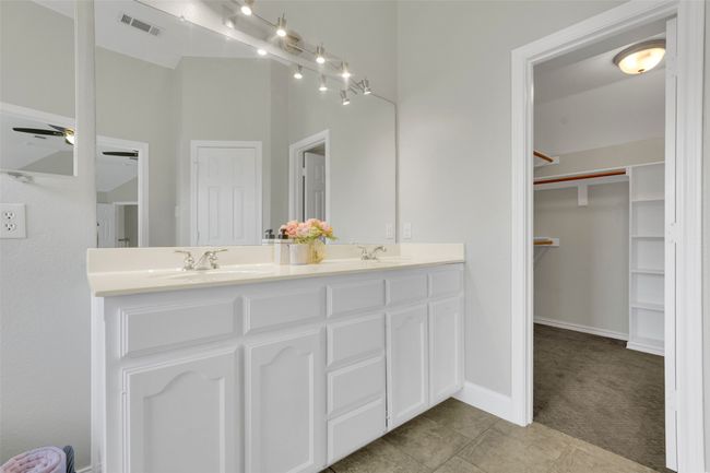 Bathroom with double vanity, tile patterned flooring, a spacious closet, and ceiling fan | Image 33