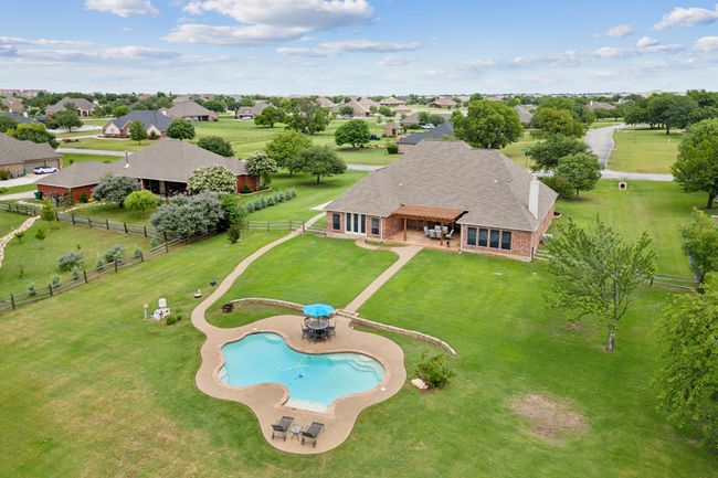Aerial view of property and surrounding area featuring a pool | Image 40