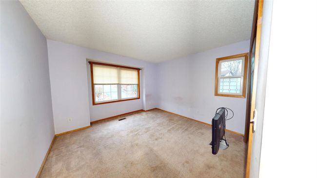 Unfurnished room with visible vents, carpet floors, a textured ceiling, and baseboards | Image 22