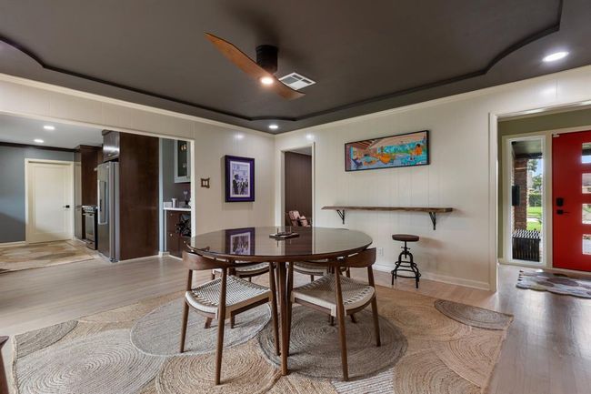 Another view of the dining room that shows the flow to the kitchen. Interior laundry room is thru the kitchen space. | Image 6