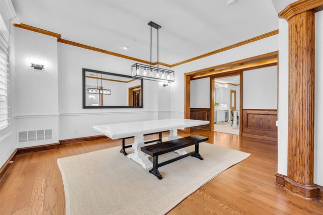 Enormous formal dining room is ready for large family gatherings | Image 11