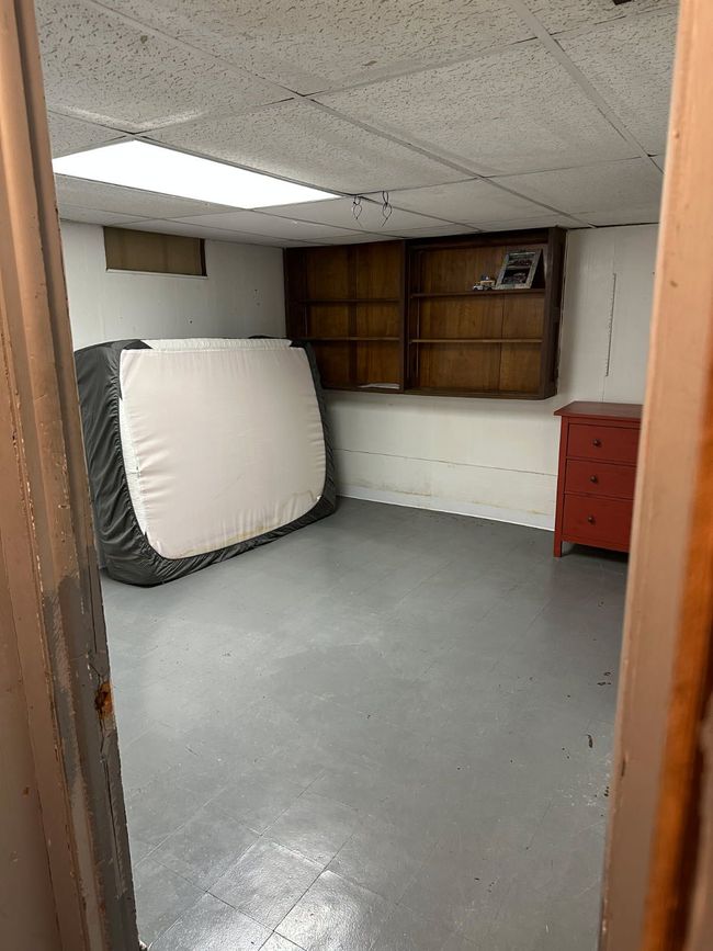 Second view of basement bedroom. | Image 17