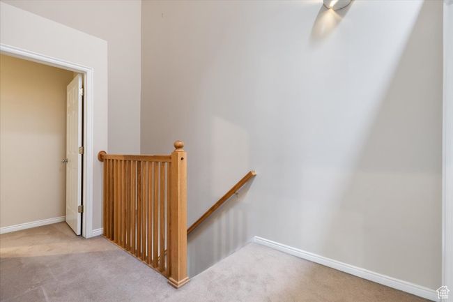 Stairs with carpet and baseboards | Image 15