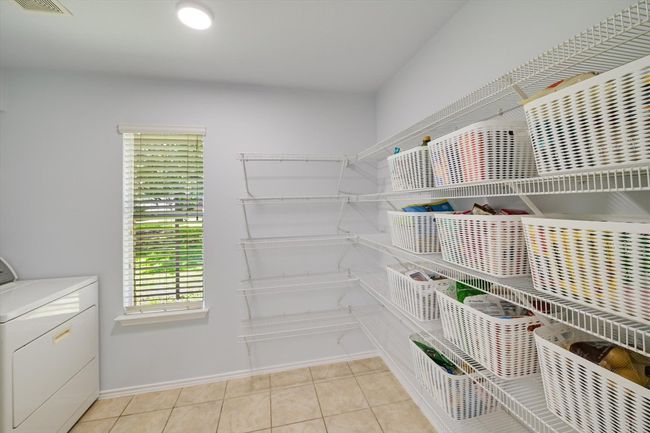 Storage area featuring washer / dryer | Image 9