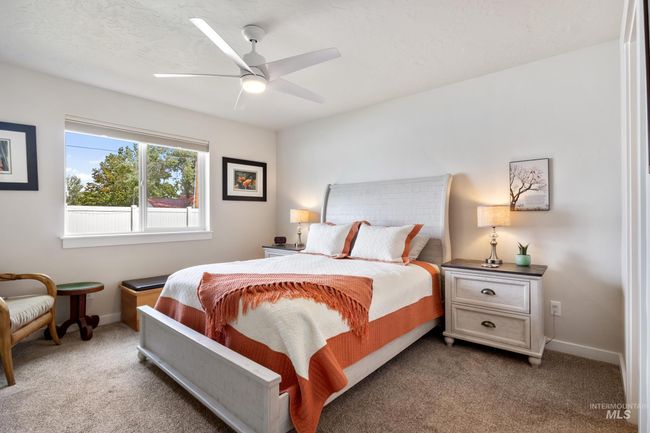 Bedroom with carpet flooring and a ceiling fan | Image 14