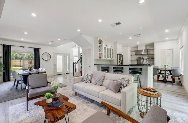 Living room featuring light wood-style floors, visible vents, and recessed lighting | Image 10