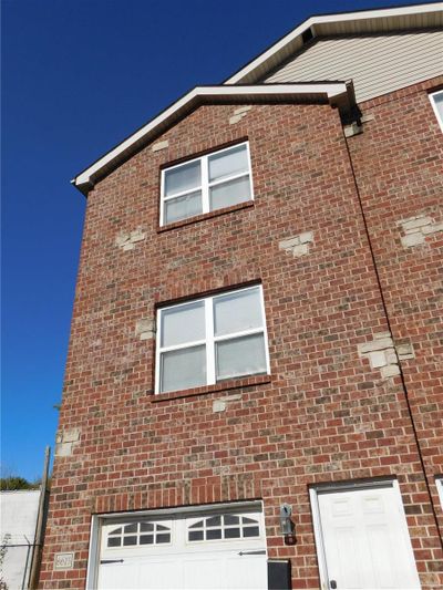 View of property exterior featuring a garage | Image 1