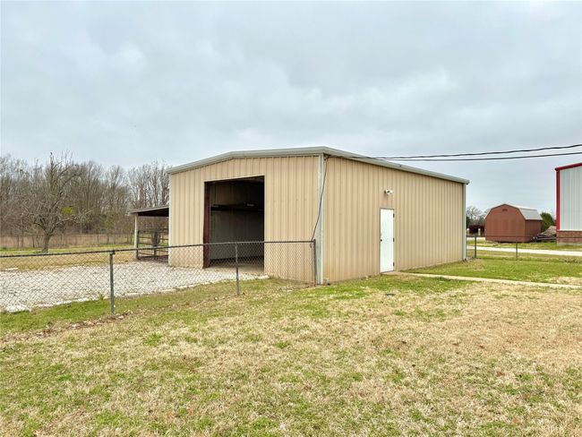 View of outbuilding featuring a yard | Image 40