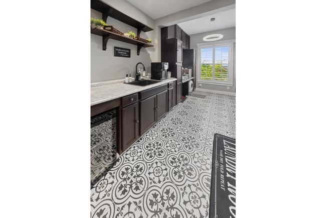 laundry room with tile patterned floors and baseboards | Image 49