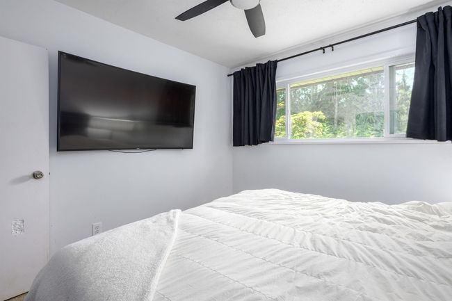 Bedroom featuring ceiling fan | Image 22