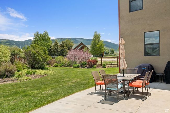 View of patio / terrace with a mountain view and outdoor dining area | Image 37
