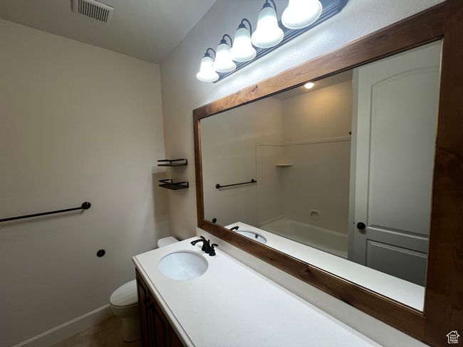 Full bath with vanity, shower / bath combination, and tile patterned floors | Image 9