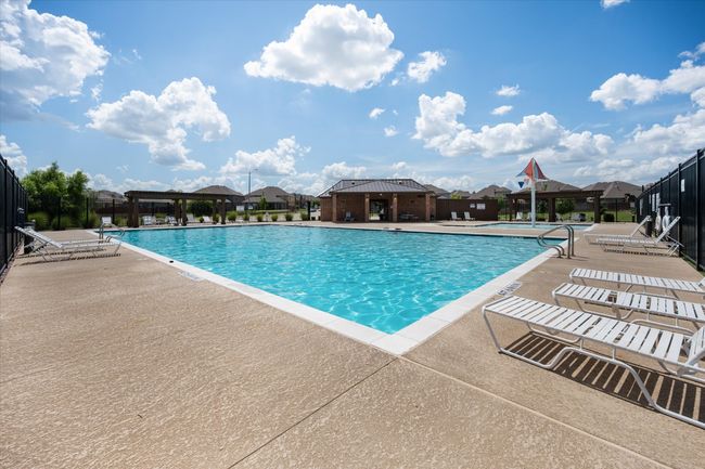 Community pool featuring a patio area and a residential view | Image 31