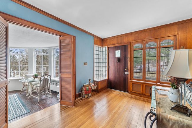 Main entrance featuring, light wood-style flooring, and crown molding | Image 4