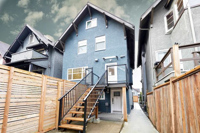 Back of house featuring stucco siding, fence private yard, stairs, and a patio | Image 18