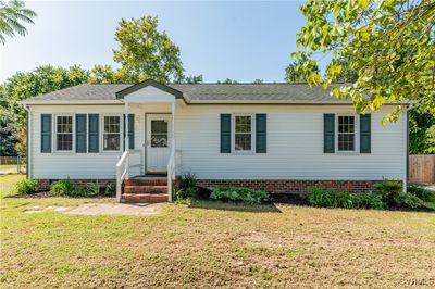 View of front facade with a front lawn | Image 2