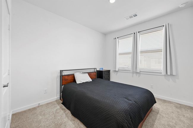 Bedroom with light colored carpet | Image 15