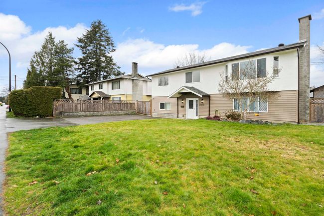 Back of property featuring fence, a yard, and a patio area | Image 24