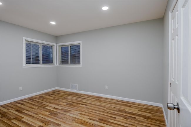Bedroom with a closet and light hardwood / wood-style floors | Image 26