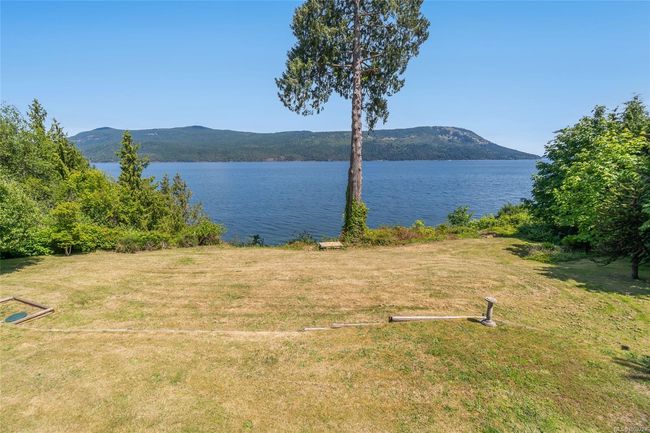 Water view with a mountain backdrop | Image 85