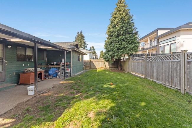 View of yard featuring a fenced backyard | Image 17