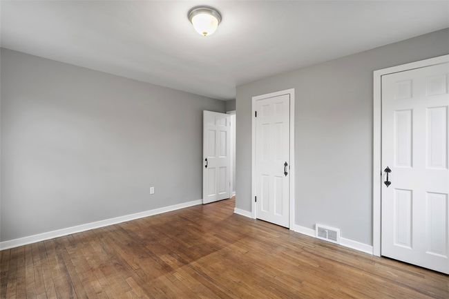 Spacious bedroom with 2 closets, lv flooring and fresh paint. | Image 14