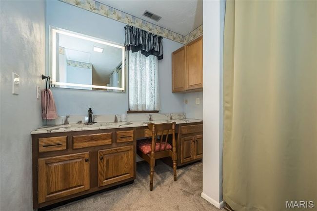 Bathroom featuring vanity | Image 29