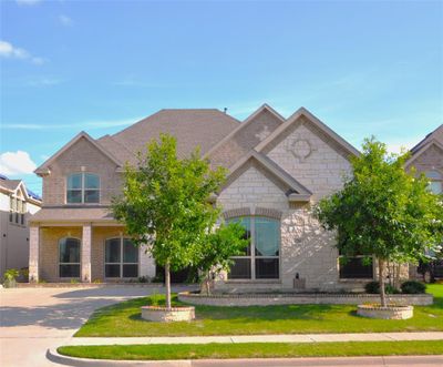 View of front facade with lots of accent stones | Image 2