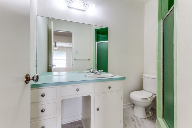 Full bathroom with vanity and shower stall. | Image 13