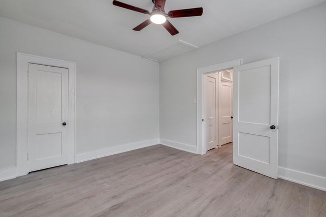 Spare room with a ceiling fan and light wood-style floors | Image 12