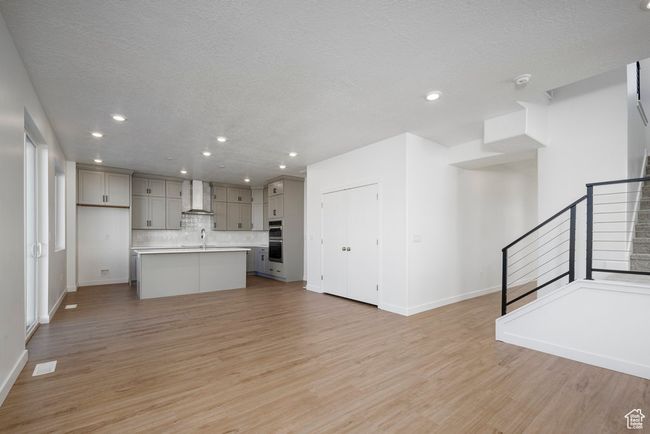 Where memories are made: a bright, open living area that flows right into the kitchen—perfect for laughter, lounging, and late-night snacks. | Image 9