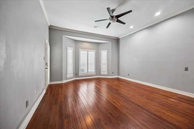 The primary suite offers its own door to the patio and pool. | Image 26